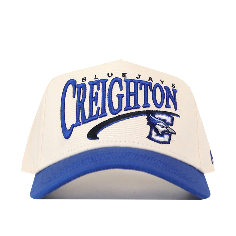 The No Rivals Creighton Bluejays Stride Hat is a white and blue snapback featuring high-quality, officially licensed team embroidery with the Creighton Bluejays name and bluejay logo on the front.