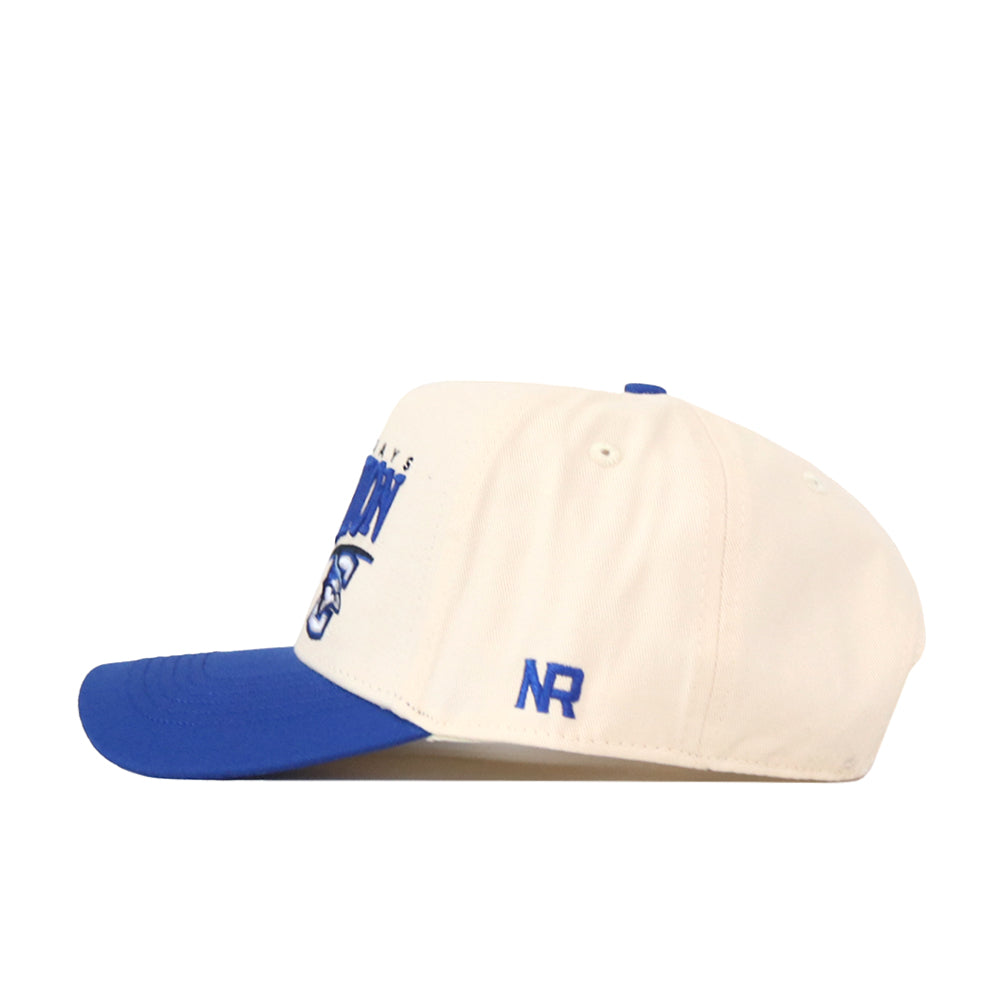 Introducing the Creighton Bluejays Stride Hat by No Rivals, an officially licensed snapback featuring a cream crown with a blue bill, blue embroidered “NR” logo on the side, and partially visible blue text and logo on the front—all crafted with high-quality embroidery for a timeless look.