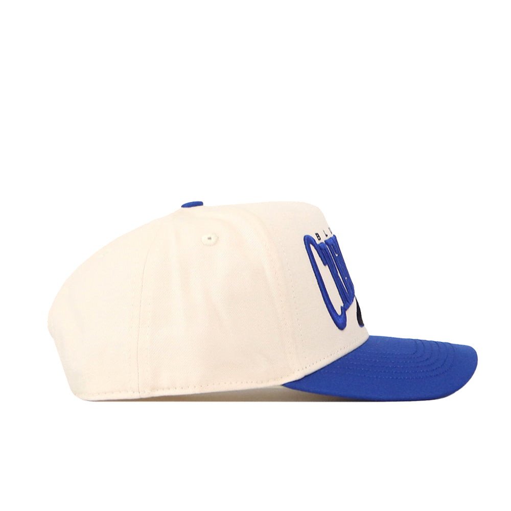 The No Rivals Creighton Bluejays Stride Hat is a white snapback featuring a blue brim and raised blue embroidered logos on the front, displayed in a side profile against a plain white background.