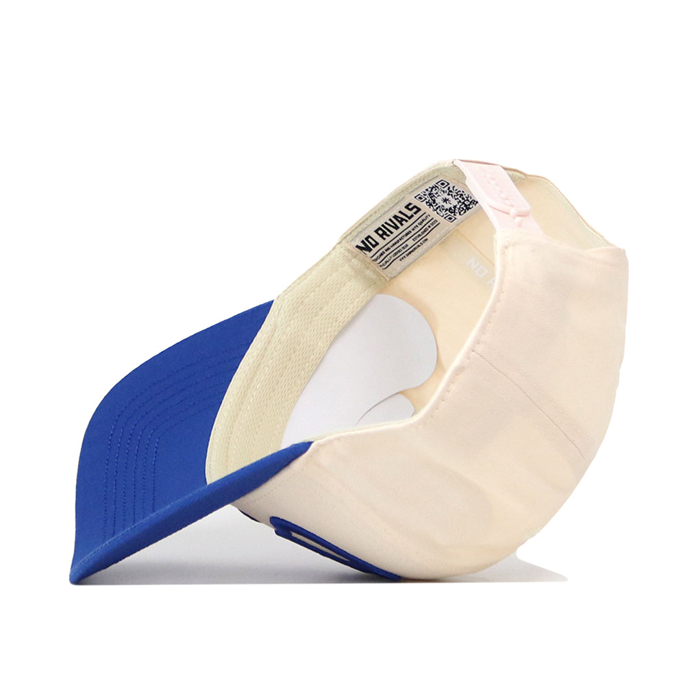 The Creighton Bluejays Stride Hat by No Rivals is displayed upside down, showcasing the inside label and sweatband. It features a blue bill, an adjustable snap back strap at the back, and premium officially licensed details for a classic look.