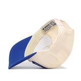 The Creighton Bluejays Stride Hat by No Rivals is displayed upside down, showcasing the inside label and sweatband. It features a blue bill, an adjustable snap back strap at the back, and premium officially licensed details for a classic look.