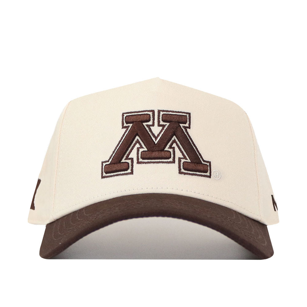 Introducing the No Rivals Minnesota Gophers Espresso Hat: This cream-colored baseball cap features a brown bill and showcases a prominent brown letter M outlined in white on the front. The classic snapback design is finished with an embroidered logo, adding extra detail and style.