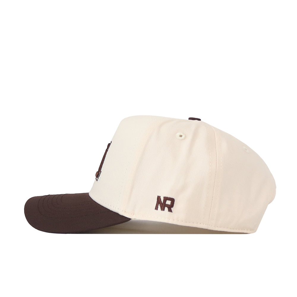 A cream-colored Minnesota Gophers Espresso Hat by No Rivals, featuring a dark brown brim and shown from the side. The stylish snapback displays the brown embroidered NR logo near the adjustable strap area.