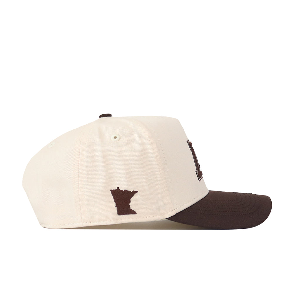 Introducing the Minnesota Gophers Espresso Hat by No Rivals: This stylish snapback features a cream-colored crown paired with a brown brim, and includes an officially licensed, embroidered outline of the state of Minnesota on the side. Adjustable for a comfortable fit.