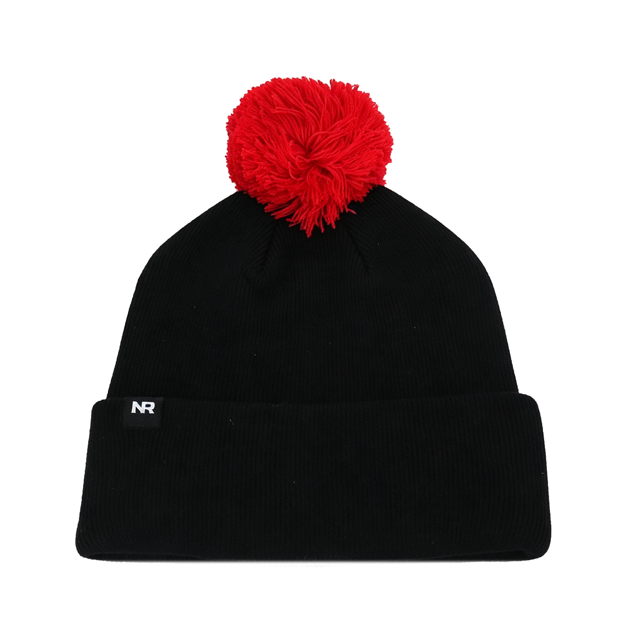 The Nebraska Cornhuskers Patch Beanie by No Rivals is a black knit beanie featuring a large red pom-pom on top and a small tag with the embroidered letters NR on the folded brim, crafted from high-quality cotton for a comfortable gameday fit.