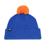 The No Rivals Boise State Broncos Logo Beanie features a blue knit design with a vibrant orange pom-pom on top, a small black NR tag on the cuff, and is crafted from a soft cotton blend for comfort and warmth.