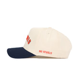 The Right Side Up Illinois Hat by No Rivals is a cream snapback with a navy brim, made from high-quality cotton and featuring bold red NO RIVALS embroidery on the side for standout style and a structured fit.