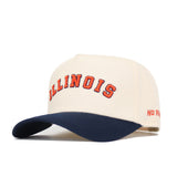 The Right Side Up Illinois Hat by No Rivals features a beige crown, navy brim, "ILLINOIS" embroidered in orange and navy on the front, and "NO RIVALS" stitched in orange on the side. Structured fit ensures comfort and style.