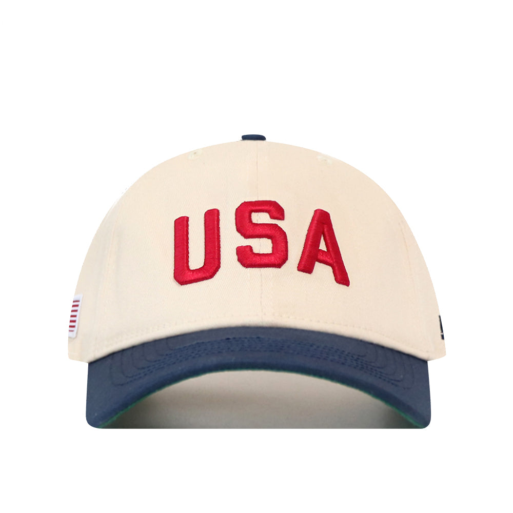No Rivals USA Vintage Hat - 6 Panel Unstructured in cream with a navy blue brim and red USA embroidery across the front.