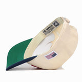 No Rivals USA Vintage Hat - 6 Panel Unstructured, a cream-colored, unstructured 6-panel baseball cap featuring a green brim, an American flag patch on the side, and internal branded labels.