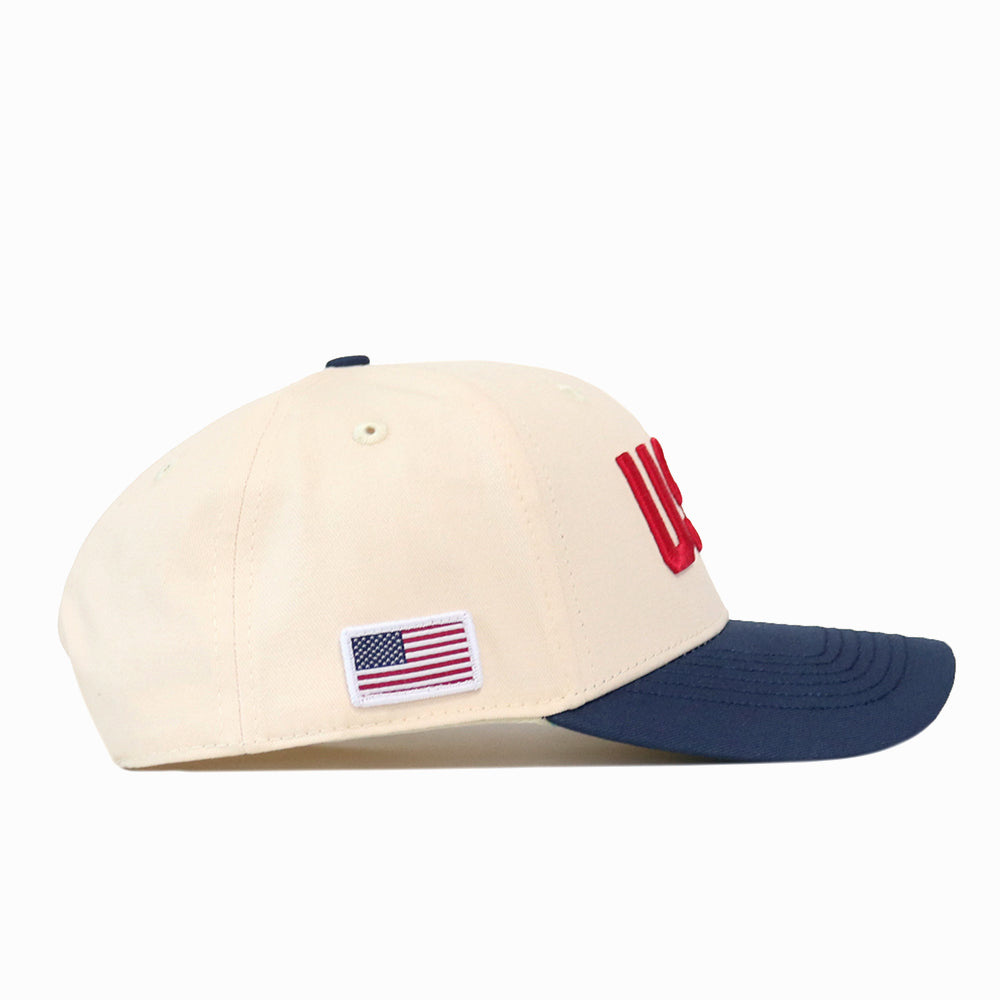 Cream USA Vintage Hat - 6 Panel Structured with a navy blue brim and an American flag patch on the side.