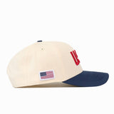 Cream USA Vintage Hat - 6 Panel Structured with a navy blue brim and an American flag patch on the side.
