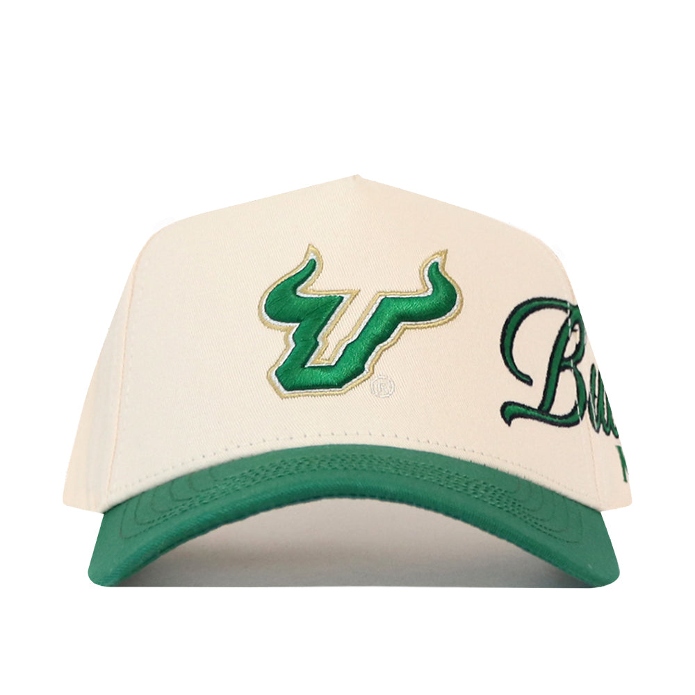 Off-white USF Halftime Hat snapback with a green brim, featuring a green bull horn logo on the front and partial green embroidered text on the side for a gameday fit.