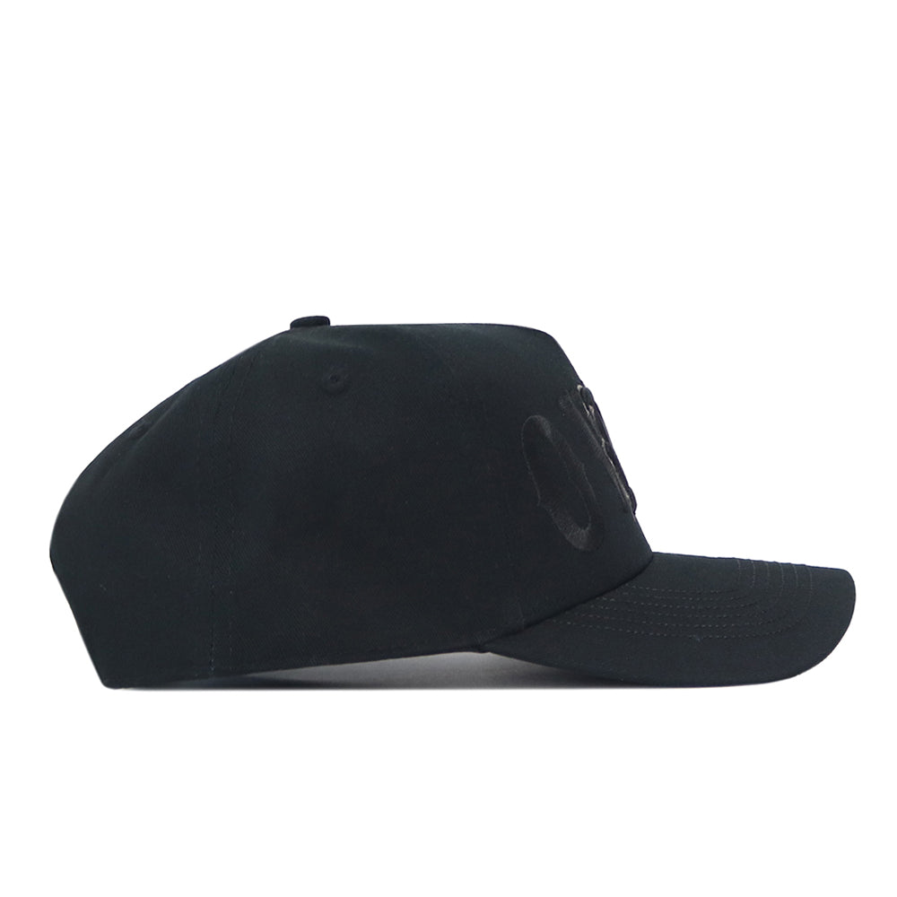 Side view of a No Rivals Rice Night Mode Hat featuring a blackout baseball cap design with a tonal embroidered patch logo on the front panel.