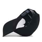 Interior view of the Texas Tech Night Mode Hat, a high-quality cotton Blackout snapback showing the internal labels and adjustable plastic closure.