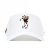 The No Rivals Texas State Golf Hat - White is a snapback with embroidered graphics of a cartoon cat in a maroon shirt swinging a golf club on the front.