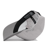 Side view of a gray Texas State Graphite Hat showing the interior lining and sweatband with No Rivals brand labels and text.