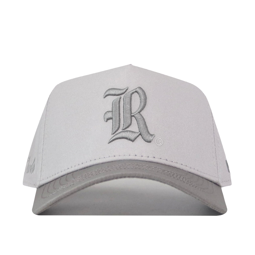 No Rivals Rice Graphite Hat: a premium structured light gray baseball cap with a dark gray bill, snapback closure, and an embroidered dark gray R logo on the front.