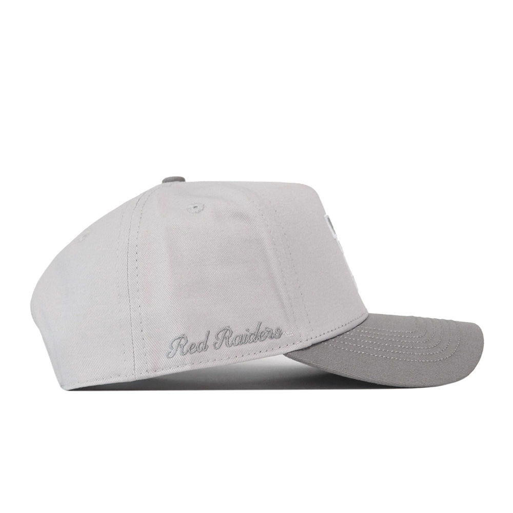 Texas Tech Graphite Hat: a light gray premium structured baseball cap with a dark gray brim and embroidered Red Raiders graphics on the side.