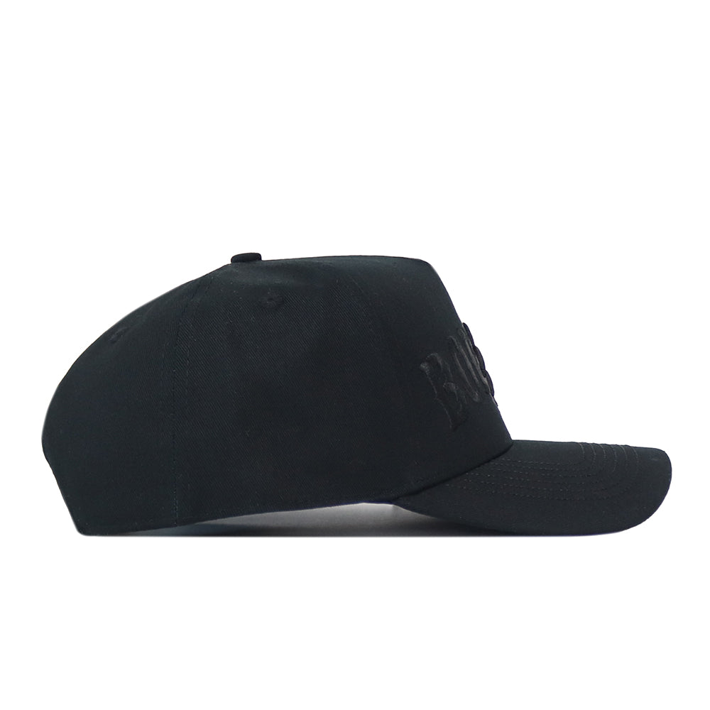 Side view of a black Texas State Night Mode hat with tonal lettering embroidered on the front.