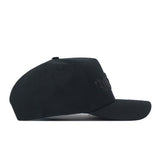 Side view of a black Texas State Night Mode hat with tonal lettering embroidered on the front.