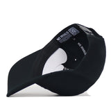 Low-angle view of a black Texas State Night Mode Hat, highlighting the interior crown lining and adjustable snapback closure.