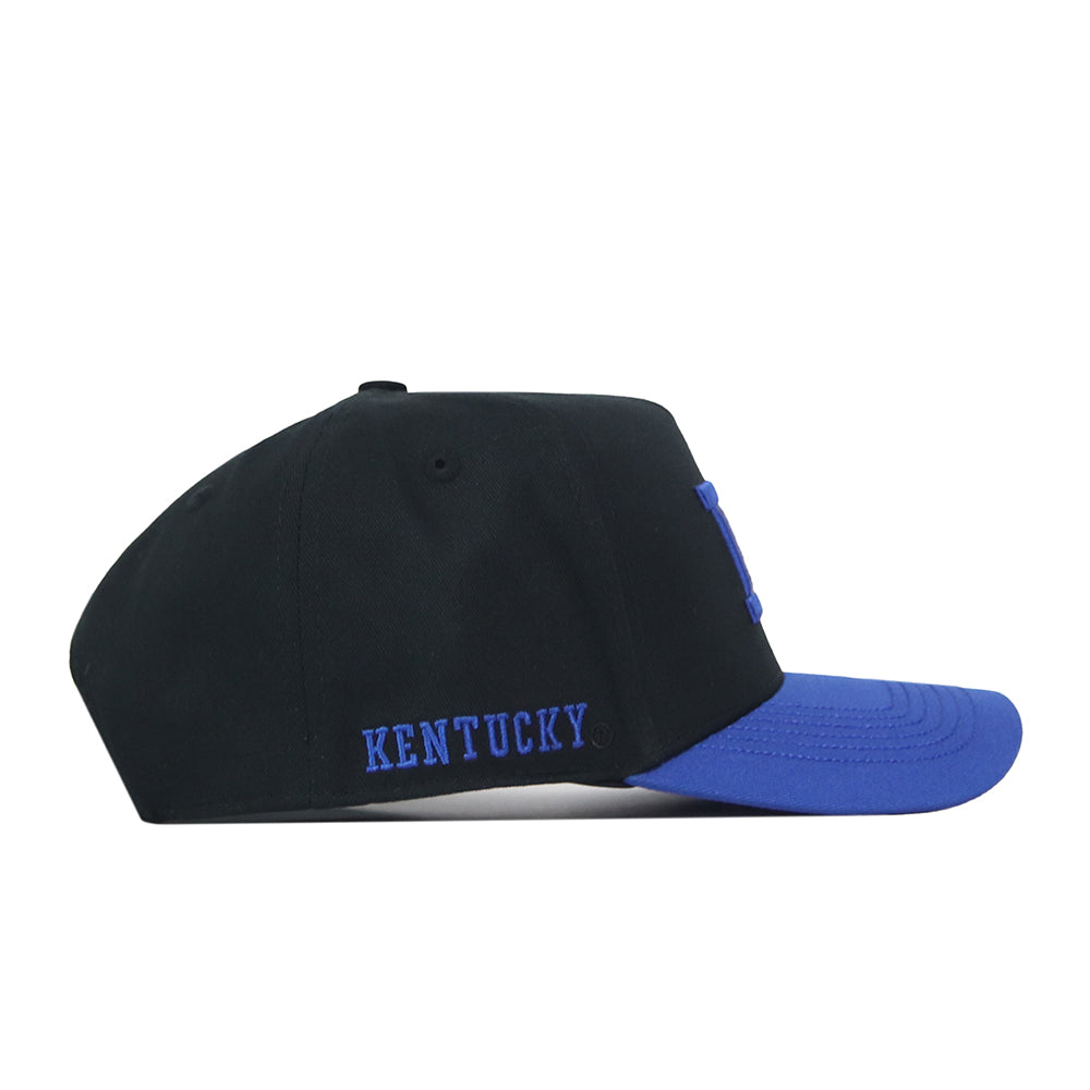 A left side view of the Kentucky Vintage K Hat - Black by No Rivals, a black baseball cap with a blue brim and an embroidered “KENTUCKY” logo in blue on the side. The adjustable snap back design ensures your perfect gameday fit.