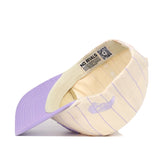The ECU Powder Purple Pinstripe Hat by No Rivals is shown upside down, revealing its lavender brim, high-quality cotton inner lining, and a NO RIVALS tag with a QR code inside.