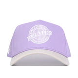 The No Rivals ECU Closer Hat in powder purple features a white brim, high-quality cotton, structured fit, and white embroidered "East Carolina Pirates Baseball Assoc." text and logo on the front.