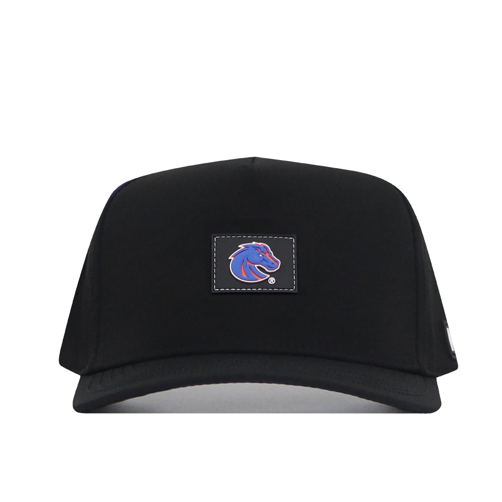 No Rivals Boise State Broncos Trainer Hat featuring a structured black design with a snapback closure, highlighted by a rectangular patch on the front that showcases the team’s blue and orange horse head logo against a black background. Officially licensed and photographed on a white backdrop, this hat offers both comfort and team pride—the perfect finishing touch to any outfit.