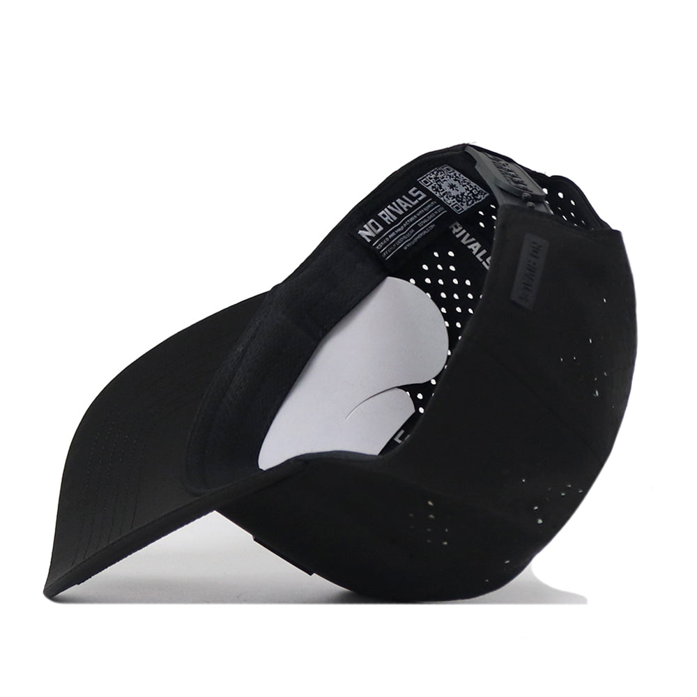 The No Rivals Boise State Broncos Trainer Hat is shown upside down, displaying the interior with a structured fit sweatband, ventilation holes, and a rectangular tag. This officially licensed cap rests on a white surface.