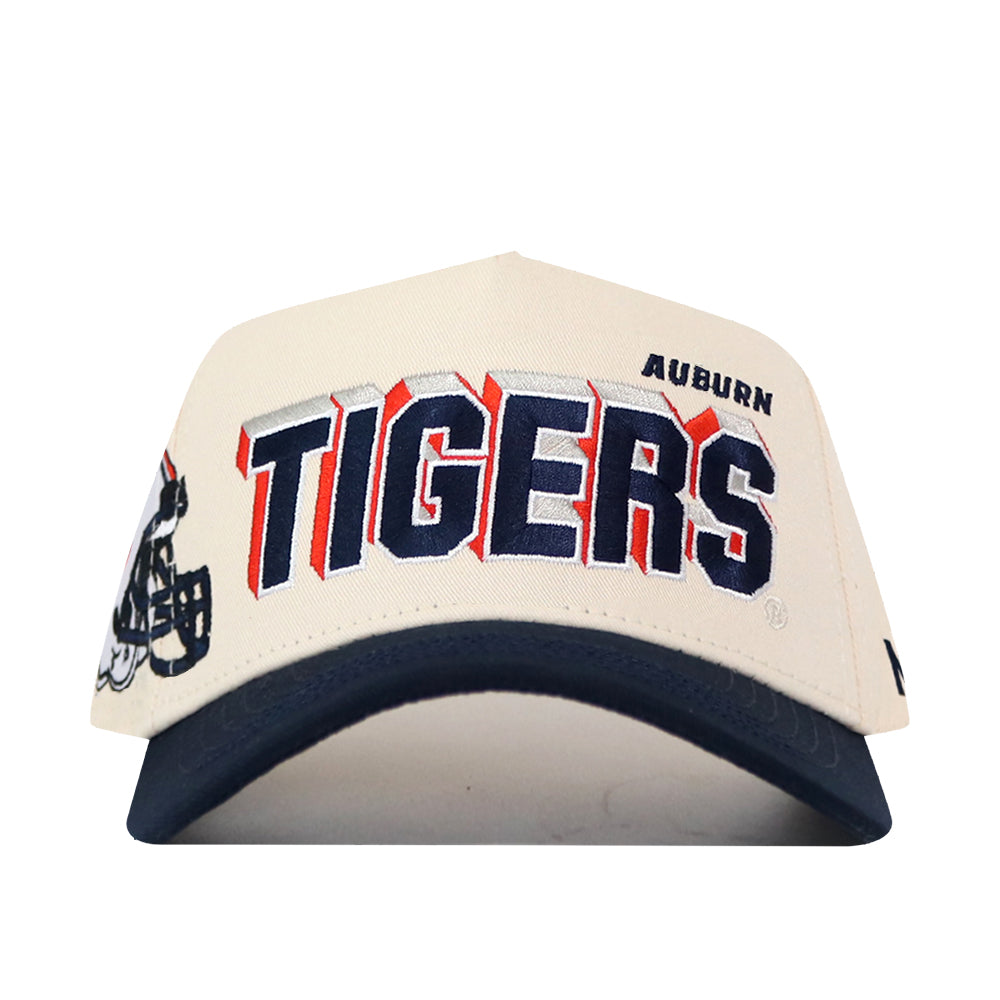 The No Rivals Auburn Alma Mater Hat is a white and navy snapback featuring “AUBURN TIGERS” boldly embroidered on the front and a partial football helmet graphic on the side—making it the perfect gameday fit.