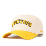 Wichita State | Upside Down Shockers Hat - Classic Colors, an off-white snapback with a yellow brim and the word SHOCKERS embroidered upside down in yellow letters with a black outline.