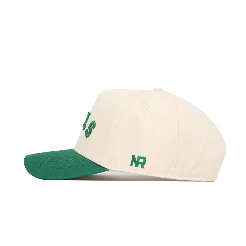 The No Rivals Right Side Up Bulls Hat - USF - Classic is a cream cotton baseball cap with a green brim, green "NR" embroidery on the side, and partial green lettering on the front, shown from the side.