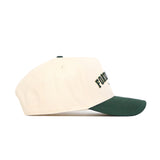 The No Rivals Fort Collins Hometown Hat is a cream snapback cap with a dark green curved brim, structured fit, and partially visible black text on the front. Made of high-quality cotton, it's shown from the side.