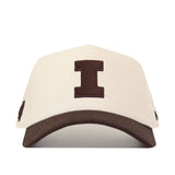 The No Rivals University of Illinois Espresso Hat features a white cotton design with a bold dark brown "I" on the front and a matching brown curved brim.