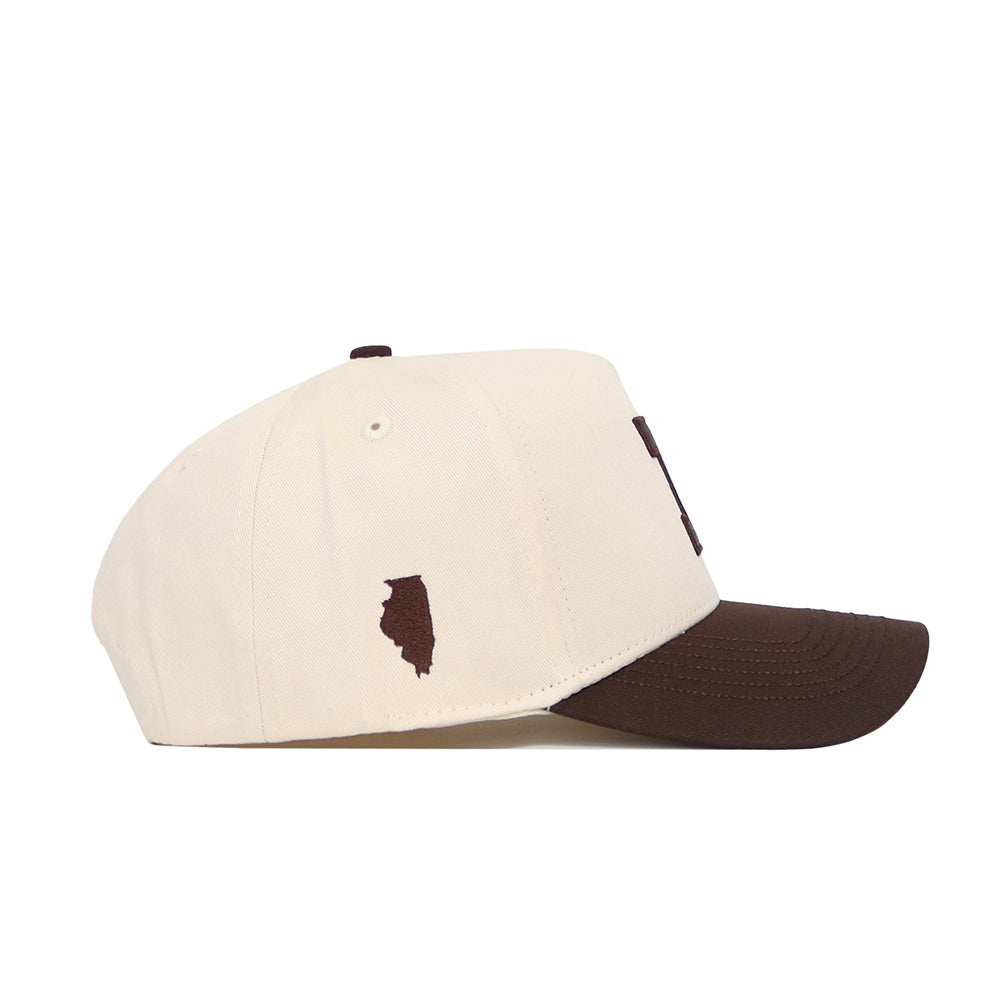 Side view of the No Rivals University of Illinois Espresso Hat: features a cream cotton crown, brown brim, and small brown Illinois outline on the side. This officially licensed snapback combines authenticity with collegiate style.