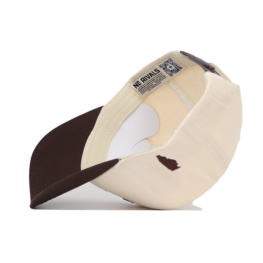 The No Rivals University of Illinois Espresso Hat, a beige and brown cotton cap with a curved brim and snapback closure, is shown upside down to reveal its inner lining, QR code tags, and subtle side logo.