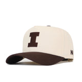 The No Rivals University of Illinois Espresso Hat features a beige cotton design with a brown bill and large brown “I” on the front. Officially licensed, it has “NP” embroidered in brown on the side.
