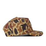 The No Rivals South Dakota State Huntsman Hat is a high-quality cotton baseball cap featuring a brown, tan, and dark brown camouflage pattern, displayed from the side on a white background.