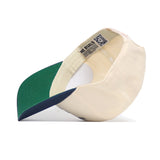 The No Rivals Florida Gators 250th Americana Hat is a beige snapback with a green underbill, navy brim edge, interior labels with brand info and QR code—officially licensed and expertly crafted inside and out.