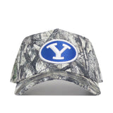The BYU Outland Hat by No Rivals is a camouflage snapback featuring a blue oval patch with a white Y logo on the front and a structured fit for lasting style.