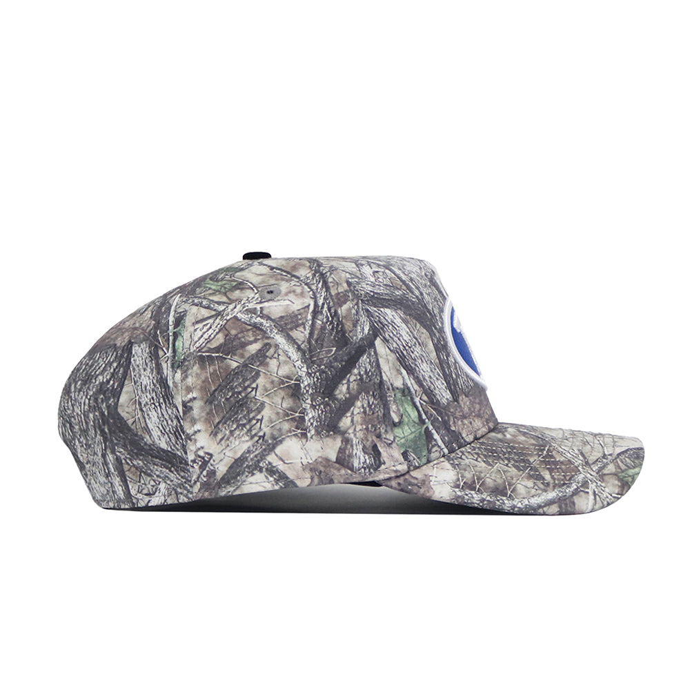 A side view of the No Rivals BYU Outland Hat shows its brown, green, and beige camo design. This structured cap has a flat brim, round crown, and adjustable snapback closure for comfort.