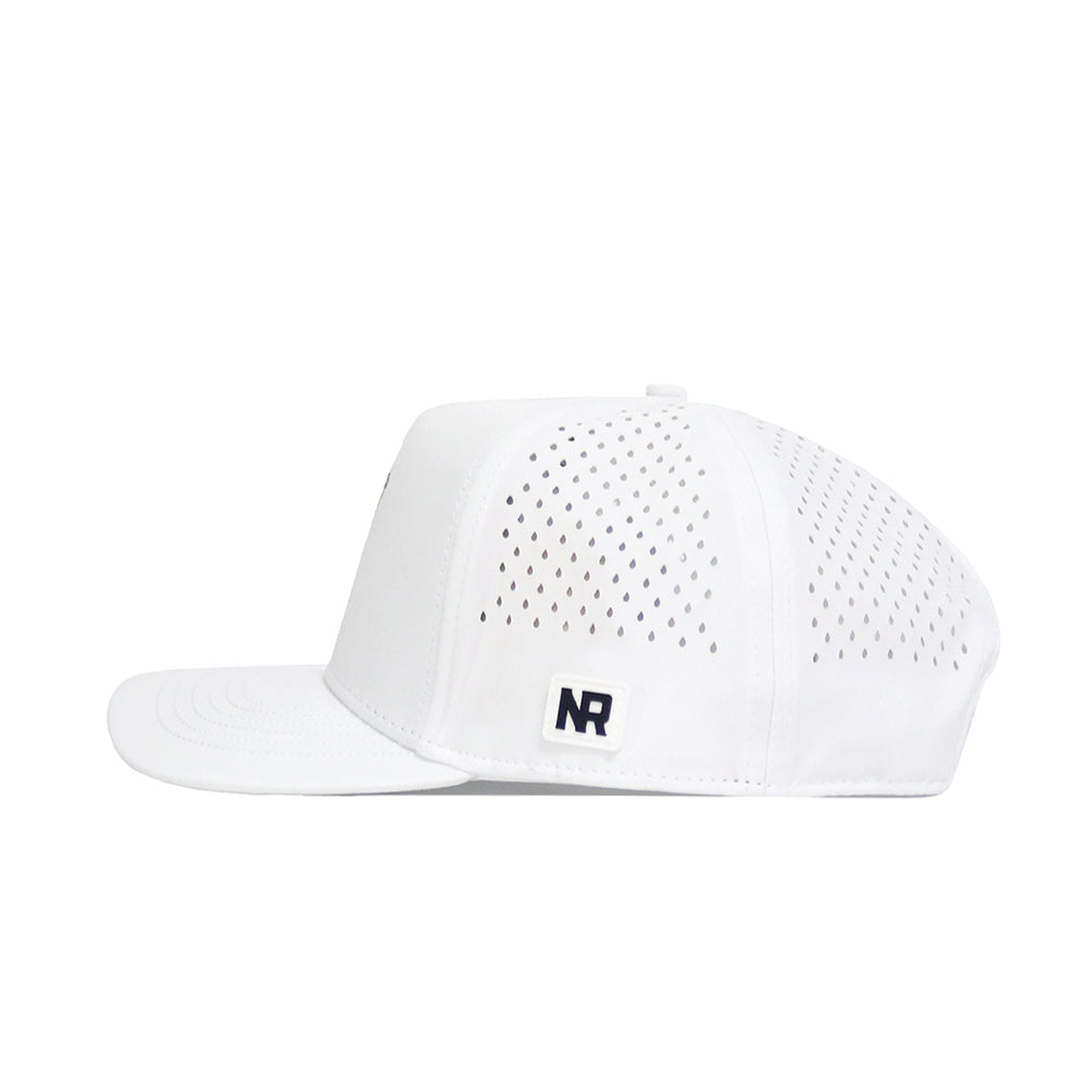 The BYU Golf Hat - White by No Rivals is a high-quality snapback with polyester-cotton blend, perforated side panels for breathability, a structured fit, and a small rectangular NR patch on the side.