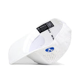 The BYU Golf Hat - White by No Rivals is shown upside down, featuring a blue side logo, small ventilation holes, and "NO RIVALS" printed repeatedly on the inner band. Made from high-quality polyester cotton for comfort and structure.