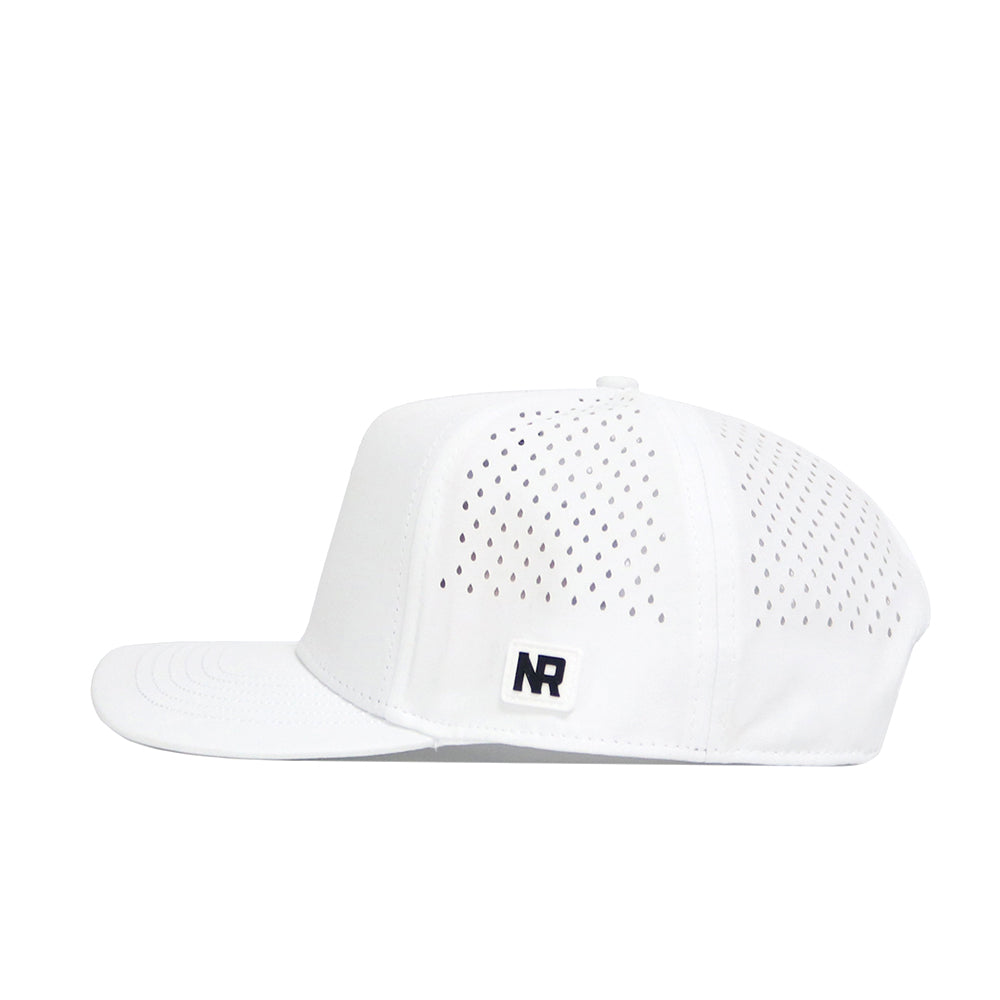 The No Rivals Alabama Golf Hat - White features a flat brim, side ventilation holes, and a black NR logo patch with embroidered graphics on the front left side. It is displayed in a side profile against a white background.
