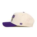 Side view of the No Rivals ECU Pirates Stride Hat, a white baseball cap featuring a purple brim and embroidered text and logo on the front. This officially licensed snapback showcases the letters "NR" in purple stitching on the side, along with high-quality embroidered logos for a stylish finish.