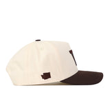 Show off your gameday style with the Washington Huskies Espresso Hat from No Rivals. This cream-colored snapback features a dark brown brim and a small brown rectangular patch on the side, as seen in its profile view. The adjustable design ensures a comfortable fit every time.