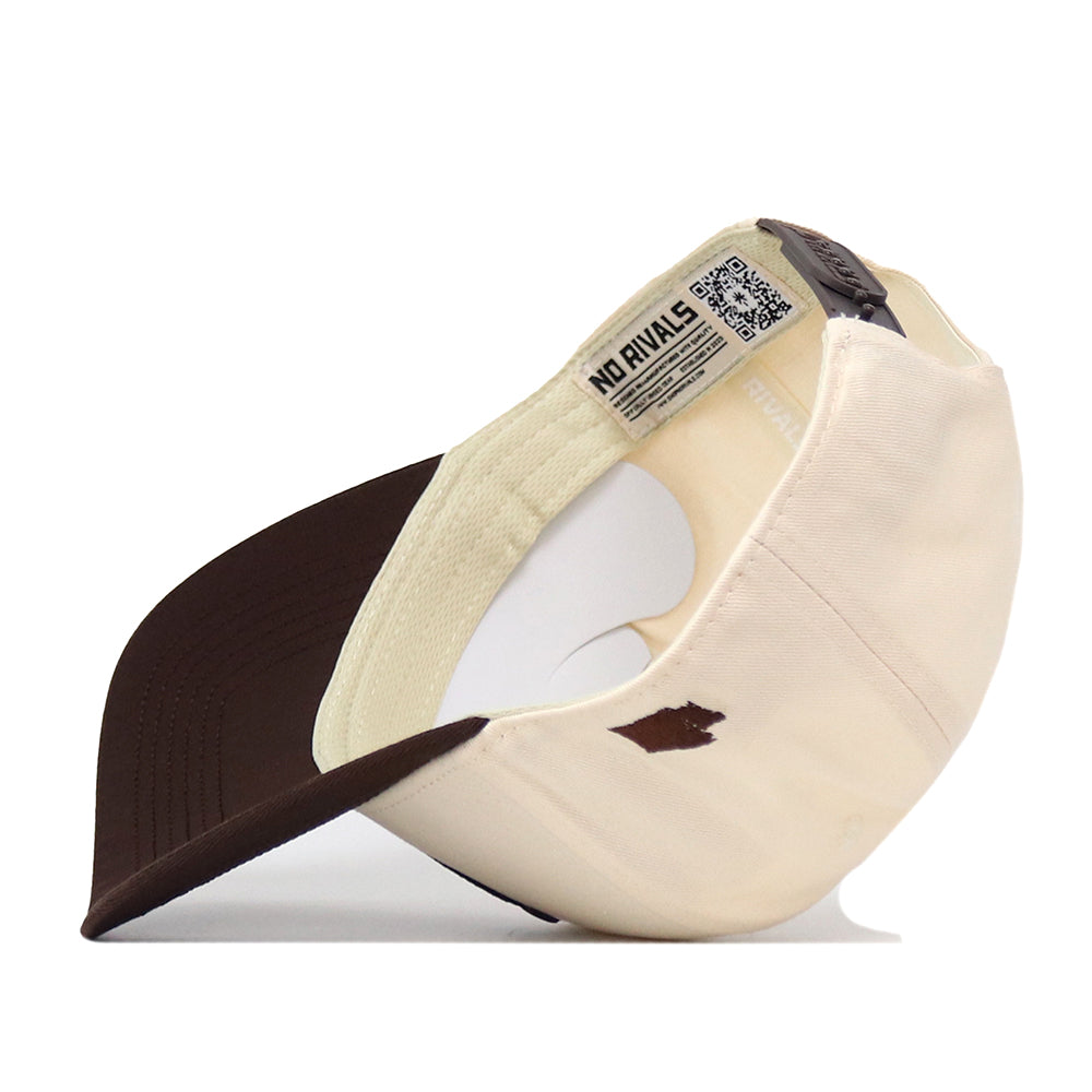 A beige and brown Washington Huskies Espresso Hat from No Rivals is shown upside down, displaying a NO RIVALS tag and a QR code on the inner band. The cap’s brown brim and part of its interior structure are visible, while the embroidered logo provides a crisp finishing touch to your perfect gameday look.