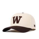 Introducing the Washington Huskies Espresso Hat by No Rivals—a beige baseball cap featuring a bold brown “W” embroidered on the front and a matching brown brim. The left side displays the embroidered “NR” logo, while an adjustable snap back ensures a comfortable fit.